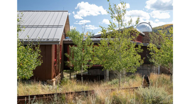 Inspired by historic flumes, the steel runnel includes ten weirs that break the flow into subtle, rhythmic gestures. These small drops enhance aeration, add acoustic texture, and create focal points along the journey from home to pond.